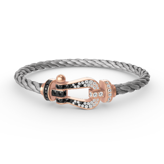 [LUXE]FORCE GROSSES HUFEISENARMBAND IN SCHWARZ UND WEISS MIT DIAMANTEN IN ROSÉGOLD